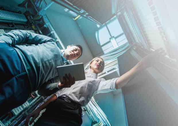 Two people at server room