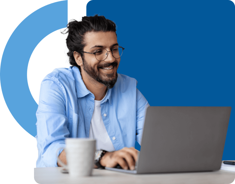 Smiling man at laptop