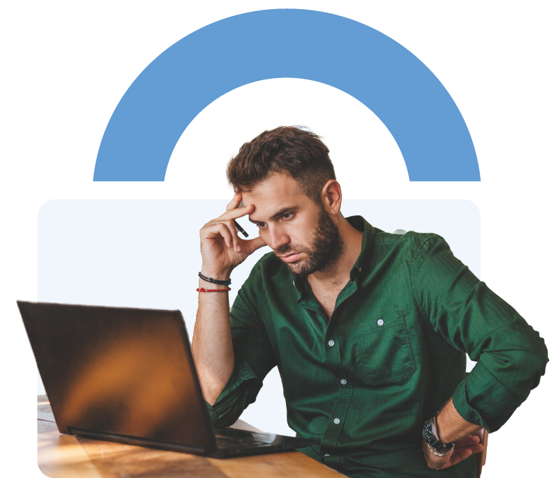 Man with a serious expression sitting at a desk, looking at a laptop screen with one hand on his temple, and a large padlock graphic in the background.