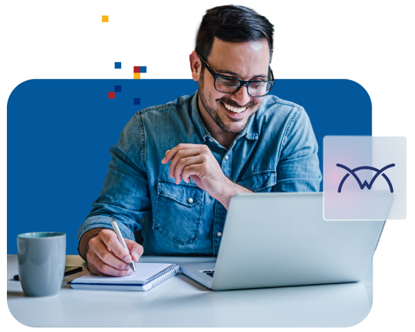 Smiling man wearing glasses working at a laptop, taking notes in a notebook at a desk with a coffee mug, digital graphics in the background.